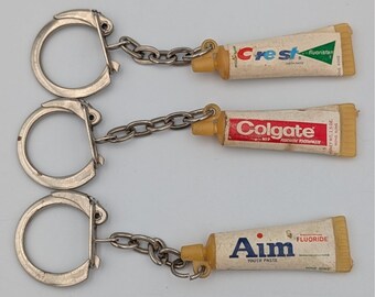 Ensemble de porte-clés de dentifrice vintage écusson Colgate Aim miniature publicitaire rétro