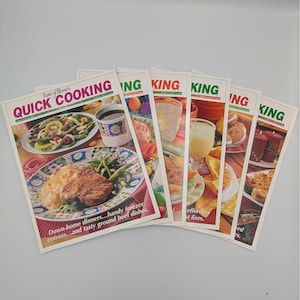 May include: A collection of vintage "Taste of Home's Quick Cooking" magazines. The covers feature colorful images of various dishes, including entrees, desserts, and drinks. The magazines are fanned out, showcasing the titles and some of the recipes.