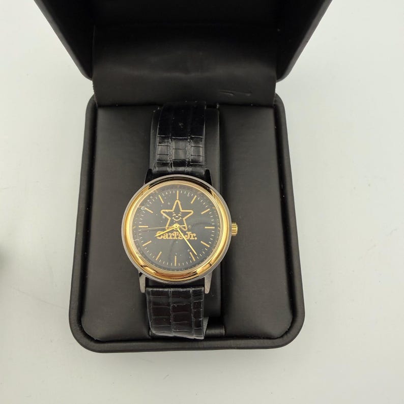 Carls Jr Armbanduhr Gold-Ton Schwarz Lederarmband Stern-Logo Analog Quarz Time Corp Bild 1