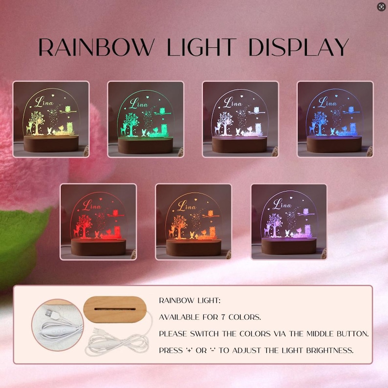Op de afbeelding: Een regenbooglichtdisplay met zeven kleuropties. Elke display heeft een houten basis en een helder acryl paneel met een boom- en dierenontwerp. De naam "Lina" is op elk paneel ge&euml;tst. De tekst "RAINBOW LIGHT DISPLAY" staat bovenaan.