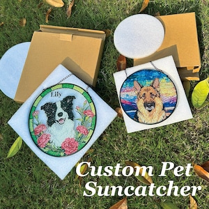 May include: Custom pet suncatchers with dog portraits. One shows a black and white dog named Lily with pink flowers. The other depicts a German Shepherd. Both are round with black chain hangers.