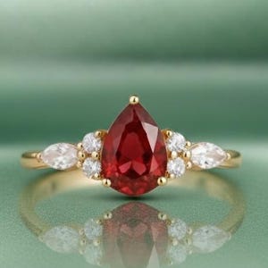 14K Gold Pear Cut Ruby Engagement Ring with Moissanite Accents  Elegant Ruby Teardrop Wedding Ring, Moissanite Halo Fine Jewelry
