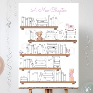 May include: A wooden easel displays a white poster with a bookshelf design. The poster features the text "A New Chapter" in pink script, along with names and illustrations of a teddy bear, rocking horse, and alphabet blocks. The shelves are filled with books.