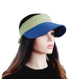 May include: A blue and green visor with a wide brim. The visor is made of a soft, comfortable fabric and has a simple, stylish design.