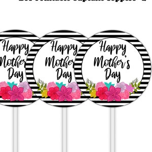 May include: Four cupcake toppers with a white background and black and white striped border. Each topper has the text "Happy Mother's Day" and a floral arrangement in pink, purple, and yellow. The toppers are on white sticks.