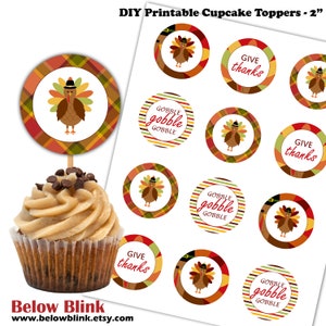 May include: Printable 2-inch cupcake toppers featuring Thanksgiving themes. Designs include turkeys, plaid patterns, and the text "Gobble Gobble Gobble" and "Give Thanks".
