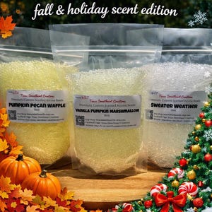 May include: Three clear plastic pouches filled with scented aroma beads, labeled Pumpkin Pecan Waffle, Vanilla Pumpkin Marshmallow, and Sweater Weather. Each 16oz bag features the Texas Sweetheart Creations logo and text. The text fall & holiday scent edition appears above the bags.