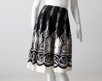 May include: A black and white printed skirt with a circle pattern. The skirt is knee-length and has a full, flowing silhouette.