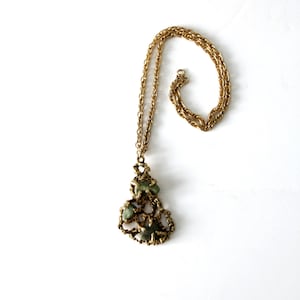 vintage gold tone brutalist style necklace with inlaid stones