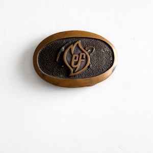 vintage logo oval brass belt buckle