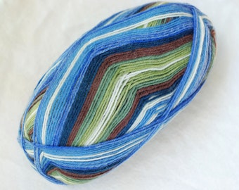 May include: A ball of yarn with a striped pattern in shades of blue, green, brown, and white. The yarn is tightly wound, showing the texture of the fibers. Ideal for knitting or crocheting projects.