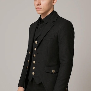 May include: A dark gray three-piece suit with gold-colored buttons. The suit includes a jacket, vest, and dress pants. The jacket has a tailored fit with a notched lapel and pockets. The vest has a row of gold buttons. The suit is made of a textured fabric.