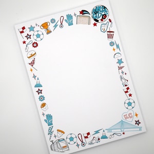 May include: White paper with a border of soccer-themed illustrations in red, blue, and yellow. The illustrations include soccer balls, stars, flags, and a cityscape with the letters "KC". The top right corner has the text "Kansas City".