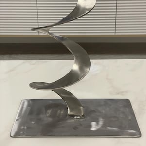 Modern sculpture made of stainless steel – handmade unique piece with steel base