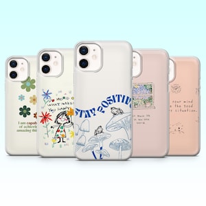 Pode incluir: Cinco capas de telefone com vários designs. Uma capa tem um design floral com o texto "I am capable of achieving amazing things." Outra apresenta uma menina com flores e o texto "Do more of what makes you happy." A terceira diz "Stay Positive."