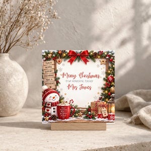 May include: A square Christmas sign featuring a snowman, a red mug with the text 'Best Teachers Make a Brighter Future', and a wooden sign listing 'TEACH, INSPIRE, SUPPORT, ENCOURAGE, MAKE A DIFFERENCE'. The text reads 'Merry Christmas TO MY WONDERFUL TEACHER Mrs Jones'.