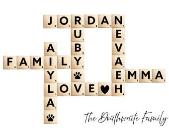 May include: A personalised family name sign in a crossword style. Names like Jordan, Aubrey, Eva, and Emma are spelt out using Scrabble tiles. The words "Family" and "Love" are included, along with paw prints and a heart symbol.
