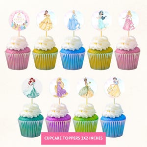 May include: Ten cupcakes with white frosting and colorful liners. Each cupcake has a princess-themed topper. The toppers feature various princesses and the text "Olivia". The bottom of the image reads "Cupcake Toppers 2x2 inches".