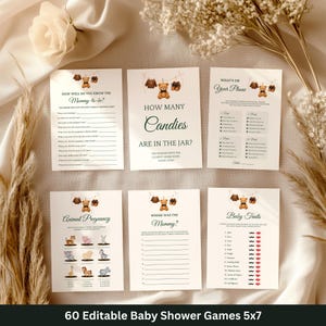 May include: A set of six baby shower games printed on white cards. The games include "How Well Do You Know the Mommy-to-be?", "How Many Candies Are in the Jar?", and "Baby Traits". The text "60 Editable Baby Shower Games 5x7" is at the bottom.