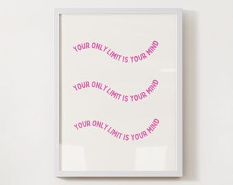 May include: Framed print with the text "YOUR ONLY LIMIT IS YOUR MIND" in a pink, curved font. The phrase is repeated three times on a white background, encased in a white frame. The artwork is displayed against a white wall.