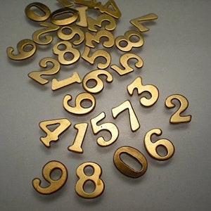 30 small brass number charms ZA760