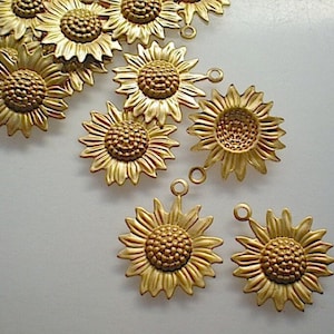 12 small brass sunflower charms ZD203
