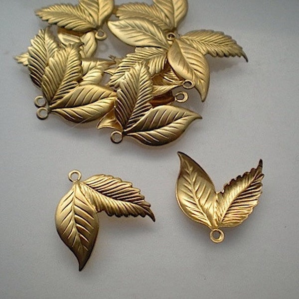 12 small brass double leaf charms ZD362