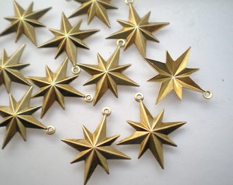 12 small starburst charms ZB345