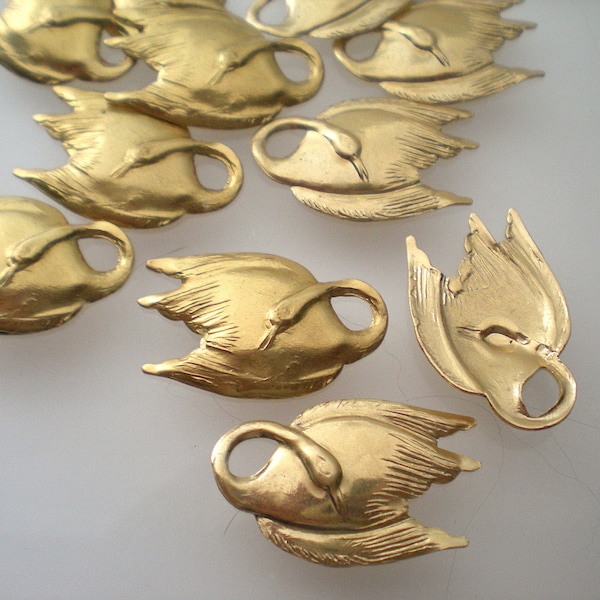 12 medium brass swan stampings (6 facing left, 6 facing right) ZE360