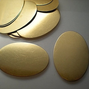 12 extra large flat brass oval discs/stamping blanks ZA503