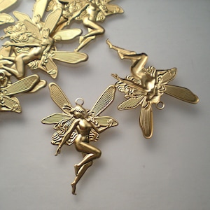 12 large brass fairy charms ZJ368