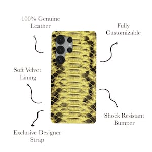 May include: A phone case with a snakeskin pattern in gold and black. The case is made of 100% genuine leather and features a soft velvet lining, a shock-resistant bumper, and an exclusive designer strap. The case is fully customizable.