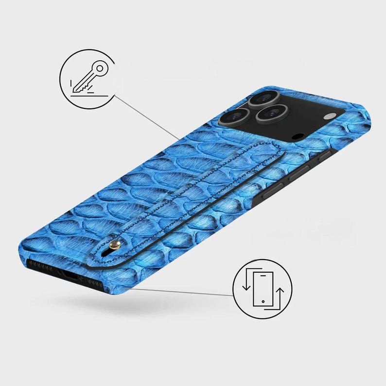 May include: A blue phone case with a scale-like texture. The case features a strap and a black camera module. The design includes a key icon and a phone with arrows icon.