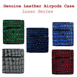May include: Genuine leather Airpods cases in various colors. The cases are embossed with a crocodile skin pattern. The available colors are green, blue, dark blue, gray, and red. The text "Genuine Leather Airpods Case Lusso Series" is at the top.
