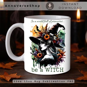 May include: A white ceramic mug featuring a watercolor-style illustration of a person wearing a large witch hat adorned with autumn flowers and pumpkins. The text reads, In a world full of princesses... be a WITCH. The design includes orange, green, and purple accents.