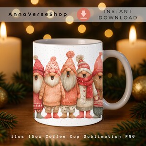 May include: White ceramic coffee mug featuring a whimsical illustration of five gnomes wearing winter attire. The gnomes have long white beards and are dressed in various shades of red, pink, and beige. The mug has a white handle and the text "AnnaVerseShop" and "INSTANT DOWNLOAD".