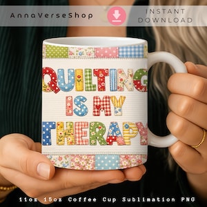 May include: White ceramic coffee mug with the text "QUILTING IS MY THERAPY" in colorful patchwork letters. The mug has a white handle and is held by a person. The mug is 11oz or 15oz.