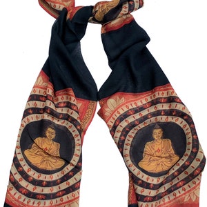 May include: Black silk scarf with a red and gold border featuring a repeating pattern of a seated Buddha figure in a circle.