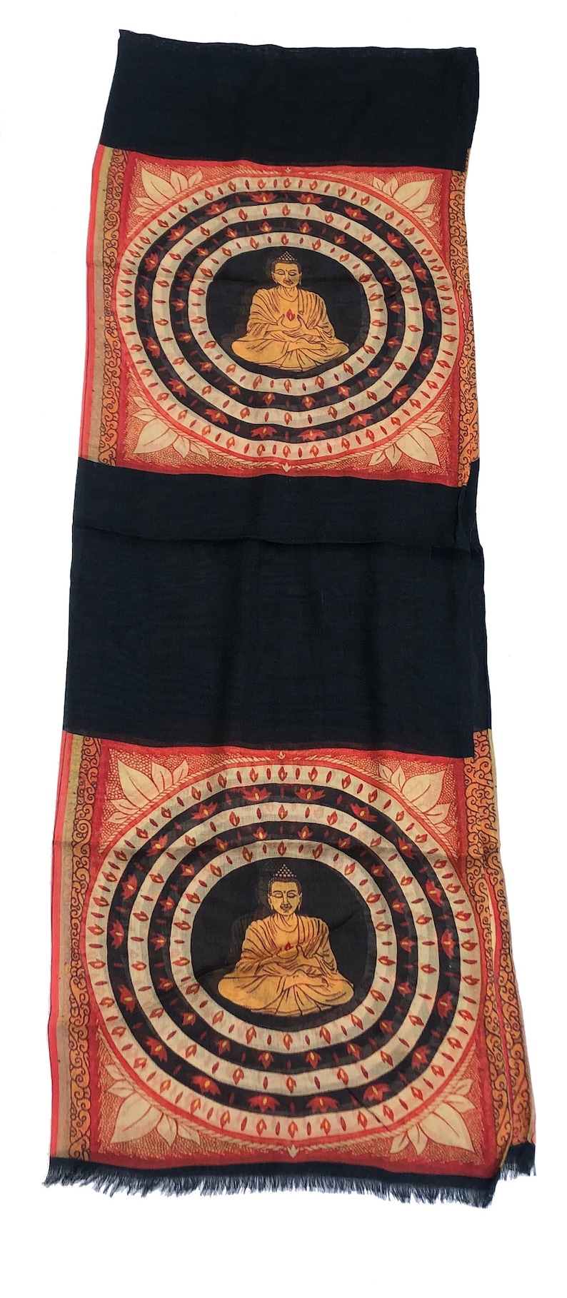 May include: Black silk scarf with a fringed edge and two printed panels. Each panel features a seated Buddha figure in a circle surrounded by a mandala design with red, orange, and white accents.