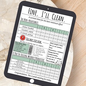 May include: A digital tablet displays a printable cleaning checklist titled "FINE. I'LL CLEAN." The sheet includes sections for daily tasks, a "You May Stop Now" section, and a "If You're Feeling Weirdly Productive" section. The tablet rests on a light-colored surface.