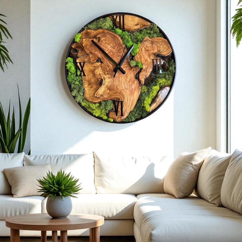 Live edge olive wood wall clock with real green moss, hanging on a rustic white wall.