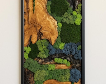 May include: A rectangular wall art piece framed in black, featuring a composition of natural light brown wood with prominent grain patterns, dark charred wood sections, and clusters of preserved moss in shades of bright green, dark green, and blue.