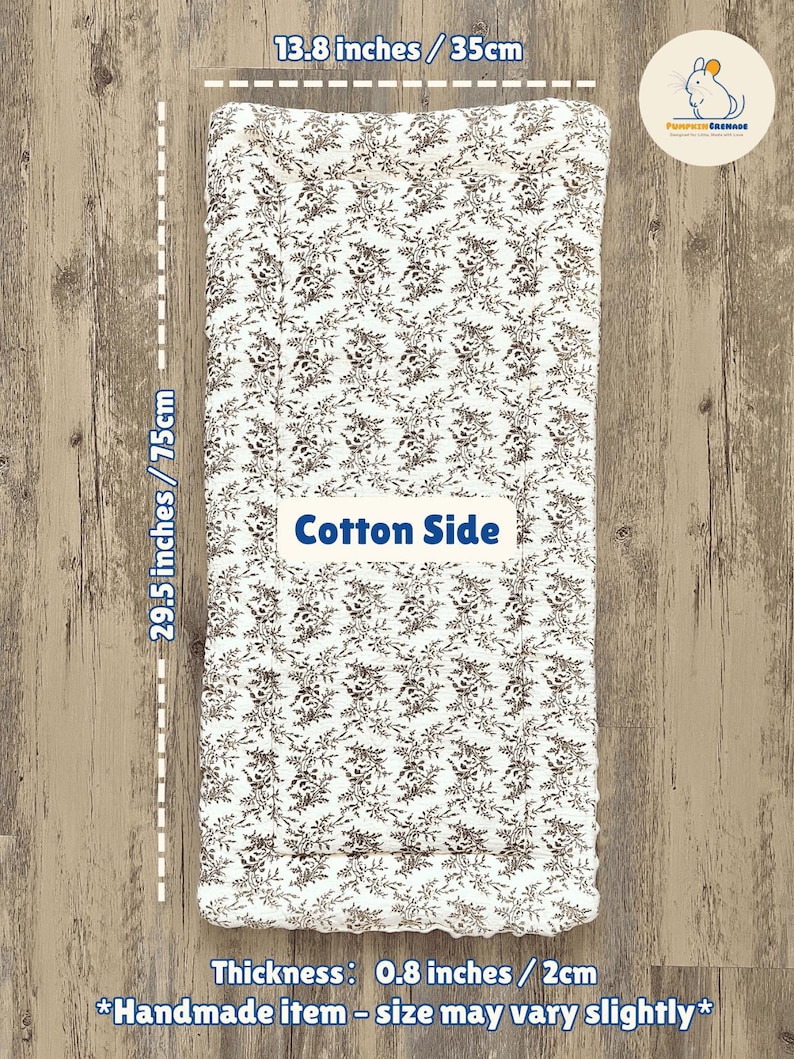 May include: A rectangular cotton item with a floral pattern in brown and white. It measures 29.5 inches (75cm) long, 13.8 inches (35cm) wide, and 0.8 inches (2cm) thick. The text "Cotton Side" is visible.