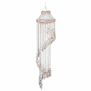 May include: A hanging mobile featuring a circular top frame adorned with light tan shells. Numerous strands of small white beads and larger, pointed off-white shells hang downward in a spiral pattern, creating a cascading, layered visual effect.