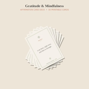 May include: A stack of 30 printable affirmation cards titled Gratitude & Mindfulness. The top card features a sun icon, the word Presence, and the text I am here, right now, and that is enough, framed by a thin border on a light beige background.
