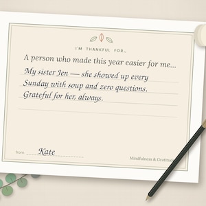 May include: A rectangular gratitude journal page with a cream background and a thin border. The text reads: I'M THANKFUL FOR... A person who made this year easier for me... My sister Jen &mdash; she showed up every Sunday with soup and zero questions. Grateful for her, always. from Kate. Mindfulness & Gratitude.