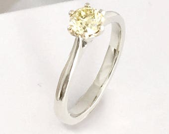 White gold and canary yellow diamond solitaire engagement ring