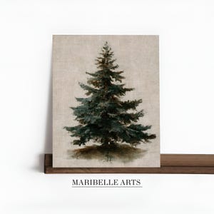 May include: A framed print featuring a detailed painting of a dark green evergreen tree. The artwork is set against a neutral beige background, with the text "MARIBELLE ARTS" at the bottom. The print is displayed on a dark wooden shelf.