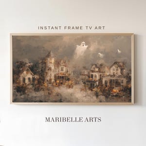 Könnte beinhalten: Gerahmter digitaler Kunstdruck mit einer gruseligen Halloween-Szene. Das Kunstwerk zeigt ein Dorf mit Häusern, Geistern und einem bewölkten Himmel. Der Text "INSTANT FRAME TV ART" und "MARIBELLE ARTS" sind sichtbar.