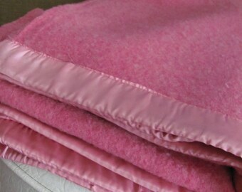 pink blanket with silk trim